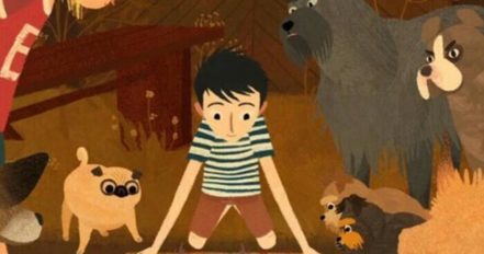 Garçon entouré de chiens dans une forêt